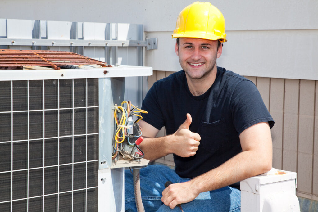 HVAC technician working on AC